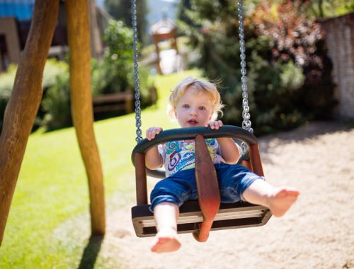 little-boy-on-the-swing-at-the-playground-PZ5DNSW.jpg